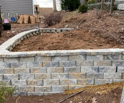 Stacked stone retaining wall